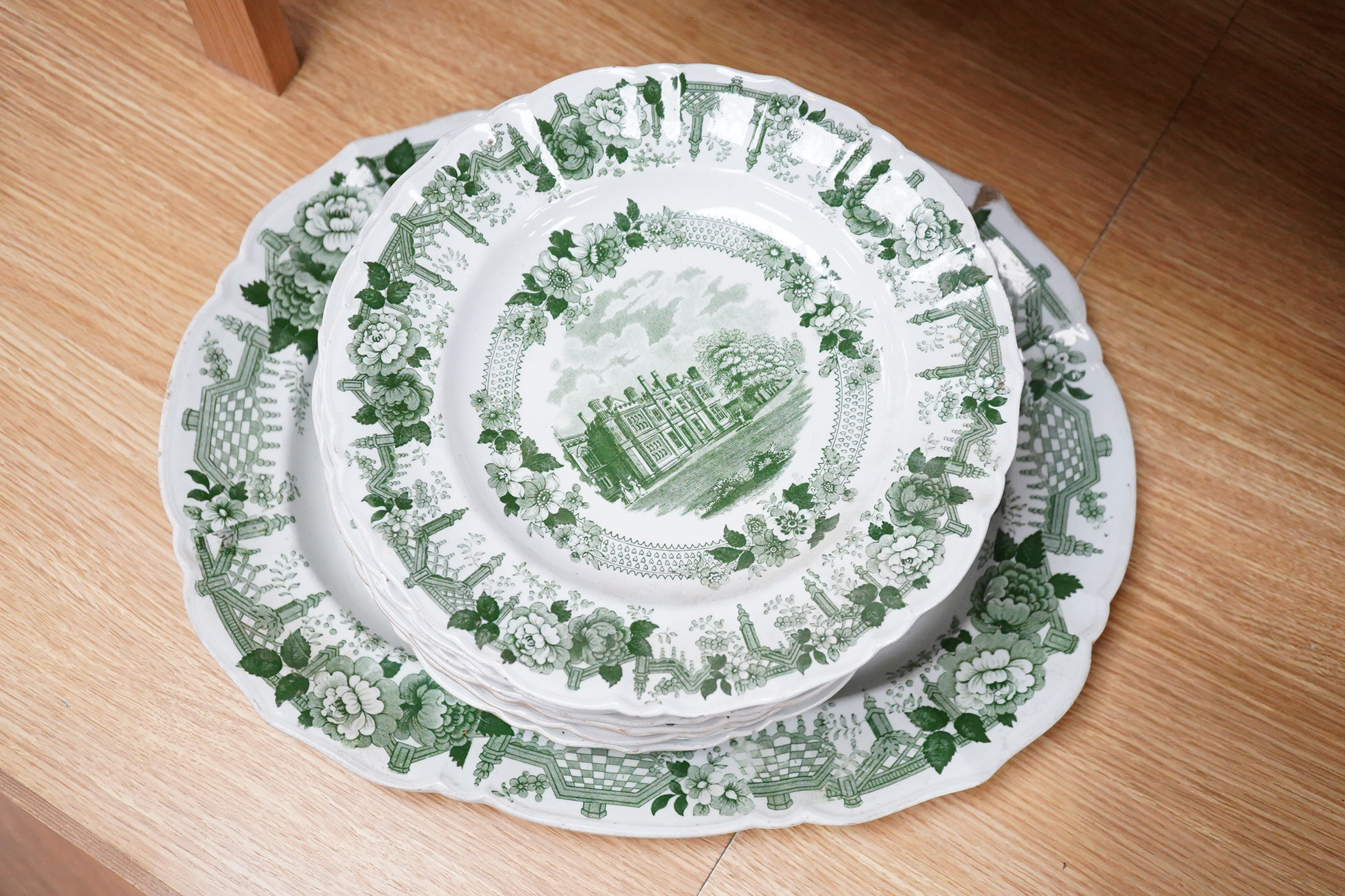 A Mason’s ironstone Cambridge colleges green printed part dinner service, c.1830-40 (11)., Oval plater 43cm wide.